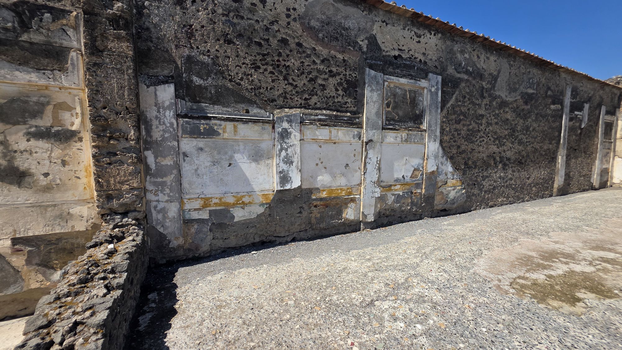 Römischer Wandputz in Pompeji der Stein und Marmor imitiert